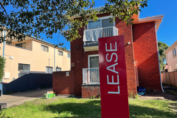 Small apartment block with a Lease sign out the front